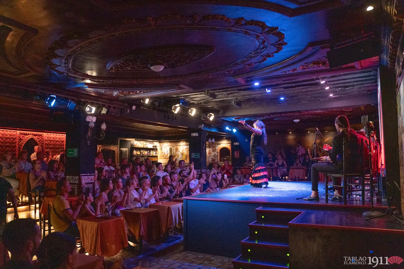 Full house watching a flamenco show at a tablao in Madrid